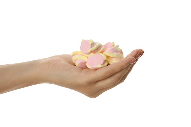 Vrouwelijke hand met zoete marshmallows