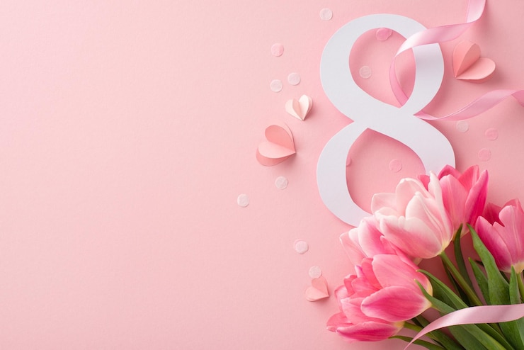 Foto vrouwendag thema overhead shot met 8 data levendige tulpen zijdeachtige lint confetti en hartvormen op een zacht roze oppervlak met ruimte voor tekst