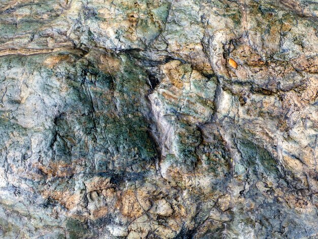 Vulkanische stenen achtergrond rock oppervlakte wallpaper achtergrond met ruwe textuur