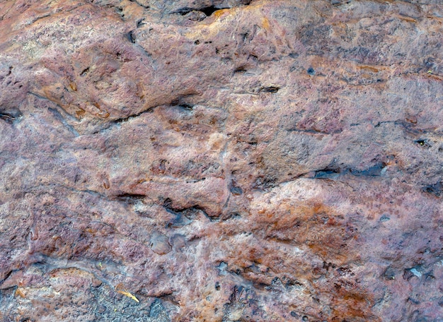 Vulkanische stenen achtergrond rock oppervlakte wallpaper achtergrond met ruwe textuur