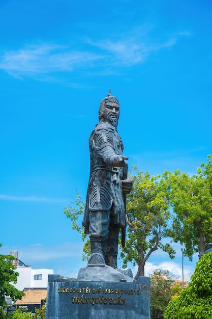 VUNG TAU MAR 13 2022 Tran Hung Dao statue in Vung Tau city in Vietnam Monument of the military leader on blue sky background