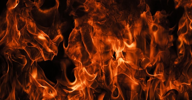 Vuurvlam branden lichten op een zwarte achtergrond