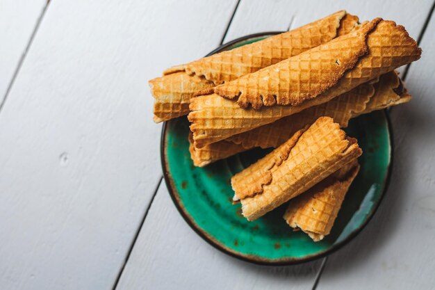 Wafer rolls with condensed milk thin and crispy waffle selective focus