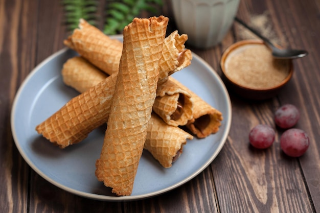 Wafer rolls with condensed milk thin and crispy waffle selective focus