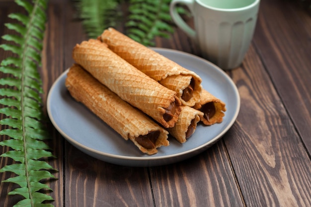 Wafer rolls with condensed milk thin and crispy waffle selective focus