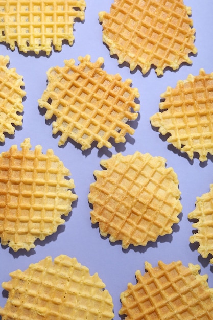 Wafer slices on violet background top view