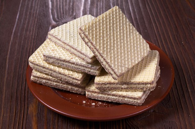 Wafers in plate on a wooden table