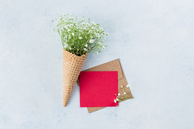 Waffle cone with gypsophila and greeting card