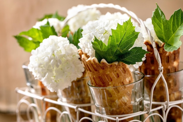 Waffle cones with white flowers