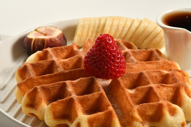 waffle plate with pieces of fruits, oriental sweets.