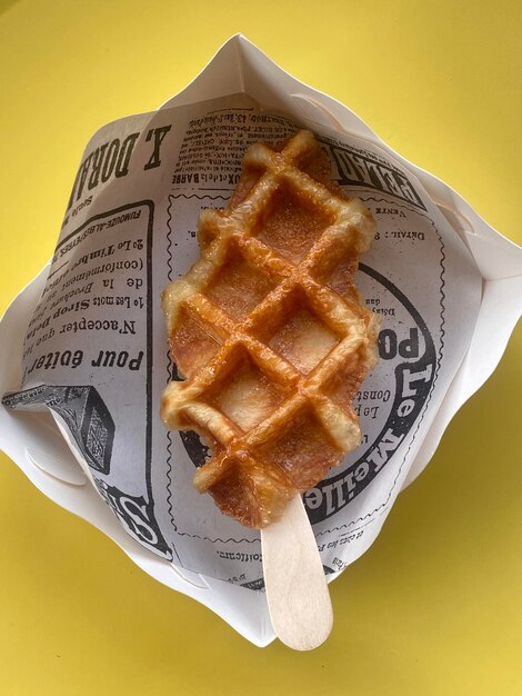 A waffle on a stick with the word " don't be fooled " on it.