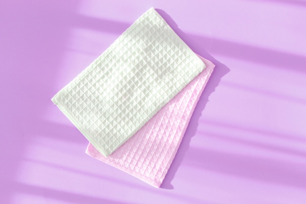 Waffle towels on purple background. Top view.