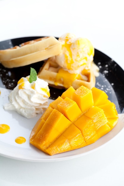 Waffle with ice cream and mango