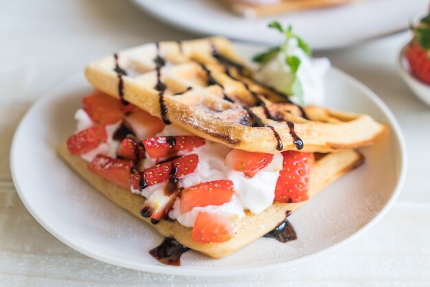 waffle with strawberry on wood