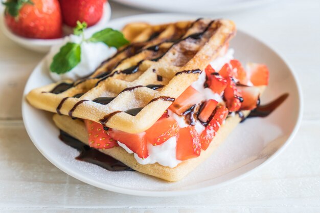 waffle with strawberry on wood