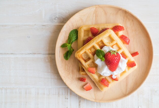 waffle with strawberry on wood