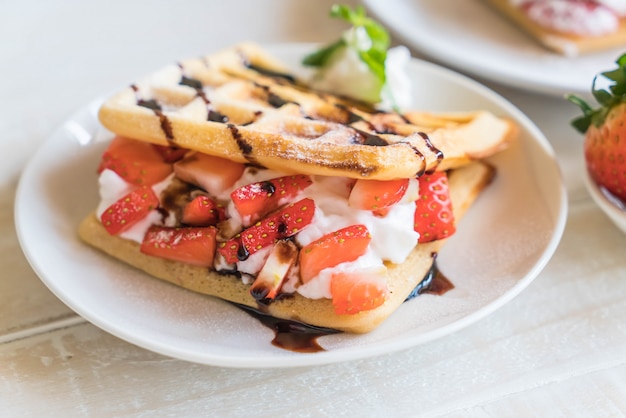 waffle with strawberry on wood