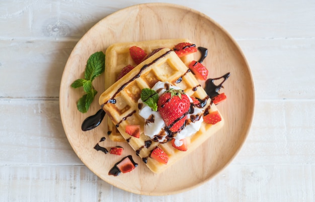 waffle with strawberry on wood