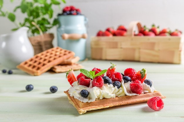 Waffle with whipped cream berry fruit and whipped cream