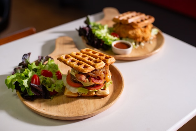 Waffles stick with meatball on wooden table