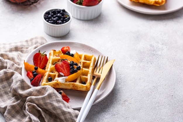 Photo waffles with berries and fruit