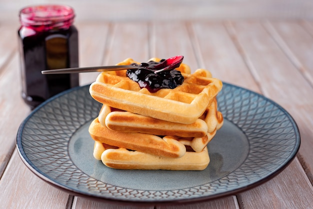 Waffles with blackcurrant jam