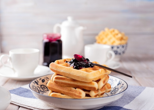 Waffles with blackcurrant jam