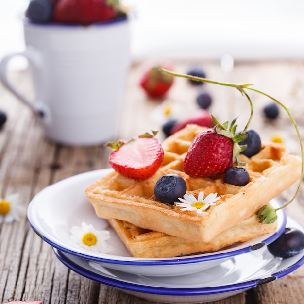 Waffles with strawberries and blueberries 