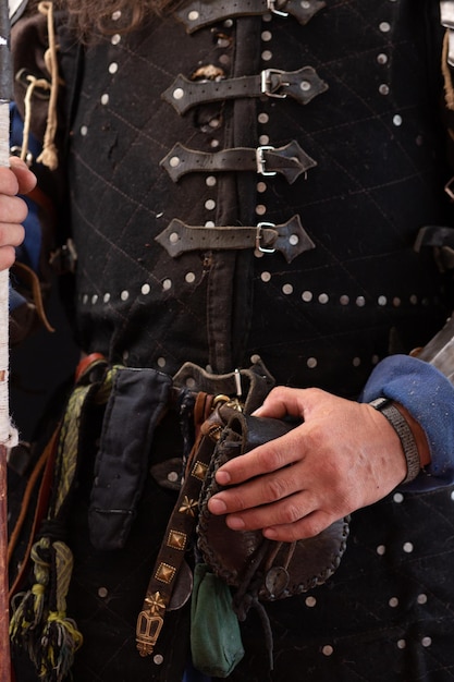 Photo waist uniform of a medieval knight closeup vertical composition