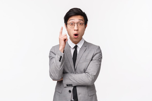 Waist-up portrait of an asian office manager in suit