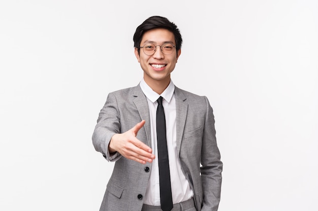 Waist-up portrait of friendly confident, successful asian businessman