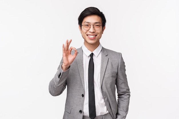 Waist-up portrait of successful happy, smiling asian businessman