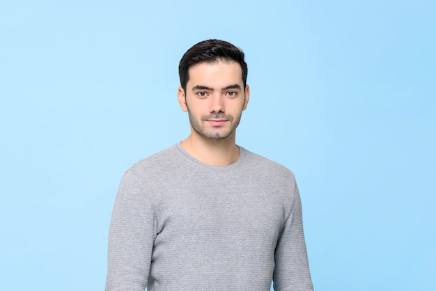 Waist up portrait of young handsome European man in plain gray t-shirt isolated