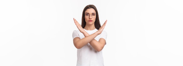 waistup portrait of determined seriouslooking young female activist saying no to women opression sho