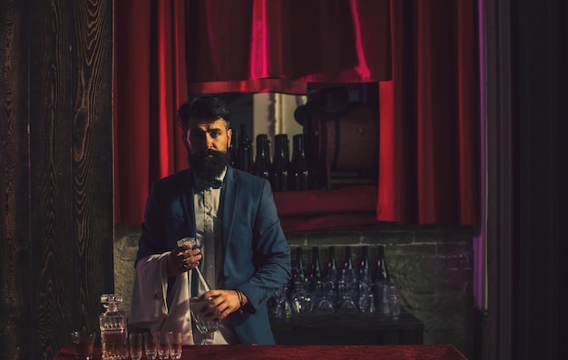 Waiter bartender in bar portrait of cheerful barman worker standing