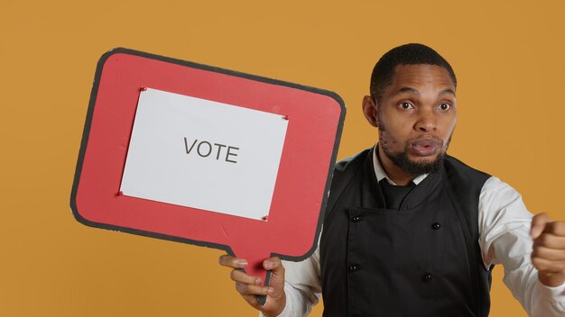 Waiter does an advertisement for politics and showing a speech bubble