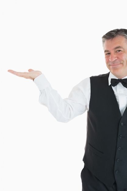 Waiter holding something