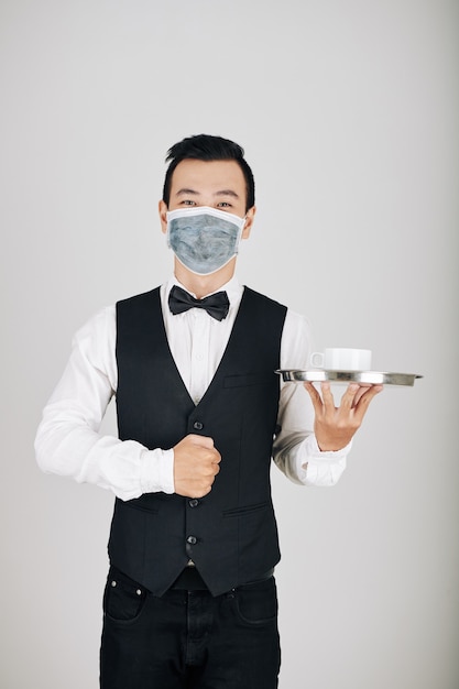 Waiter serving coffee