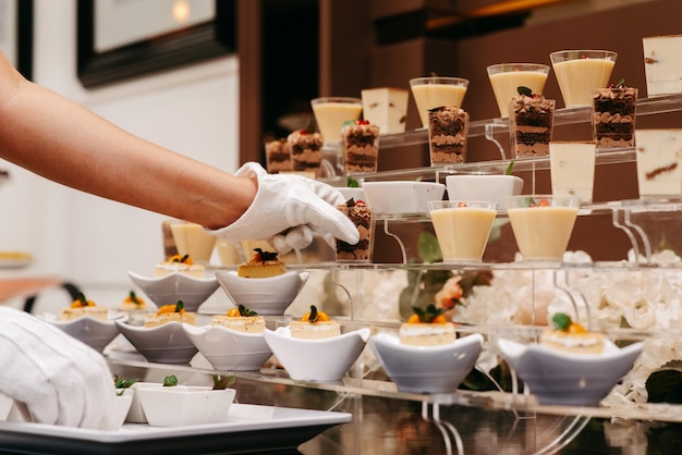 Waiter serving tray sweet dessert