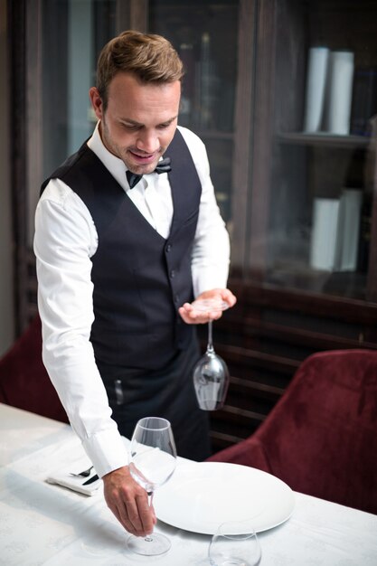 Waiter setting the table