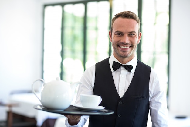 Waiter smiling at camera