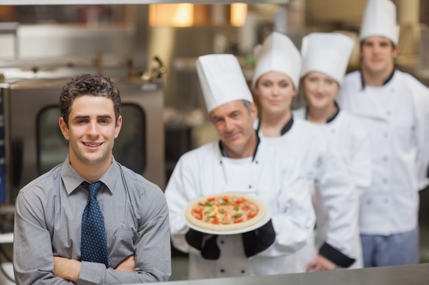 Waiter standing in front of Chef&#039;s