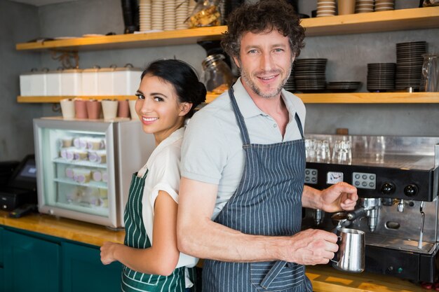 Waiter and waitress in cafeteria