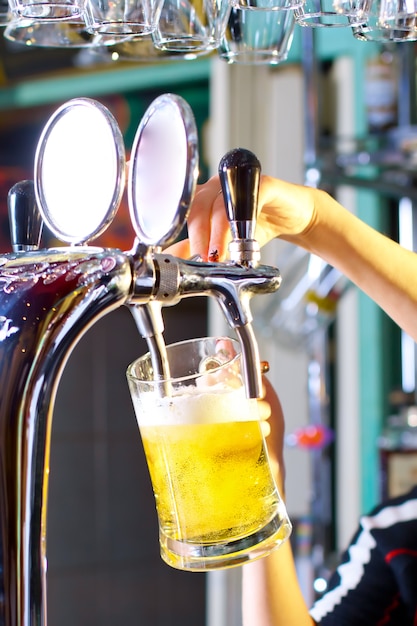 Waiting woman pouring beer