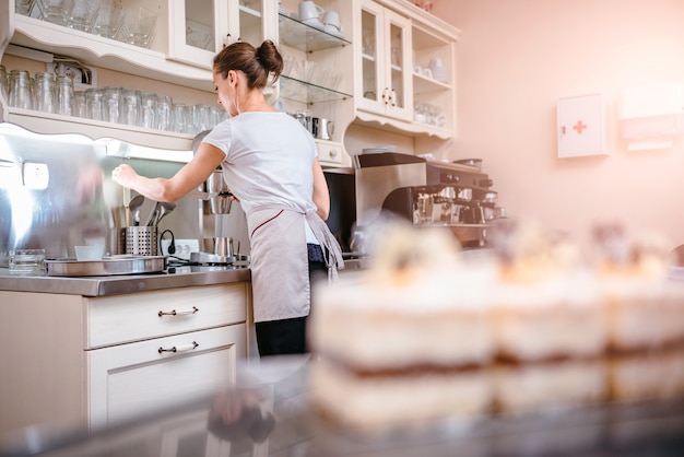 Waitress behind a counter