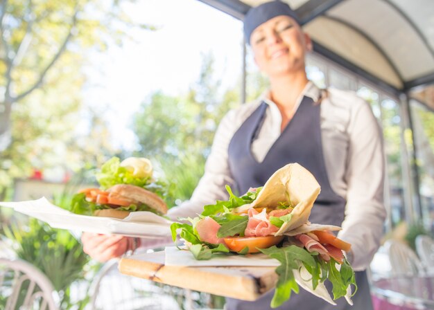 Waitress serving food