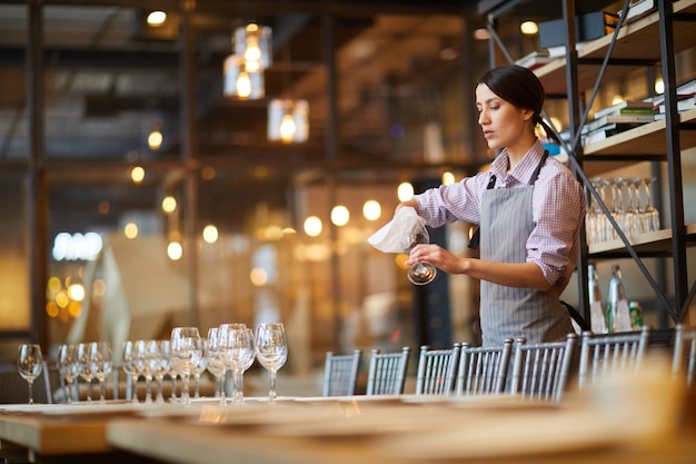 Waitress Serving Table in Cafe