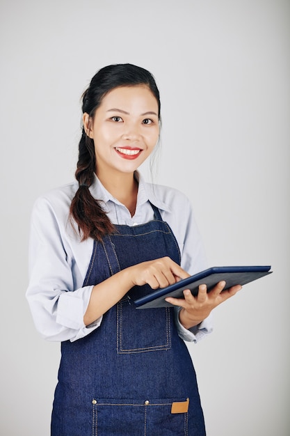 Waitress using tablet computer