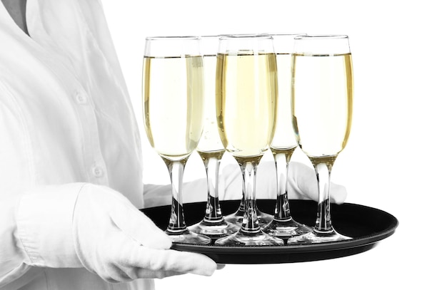 Photo waitresses holding tray with glasses of champagne isolated on white