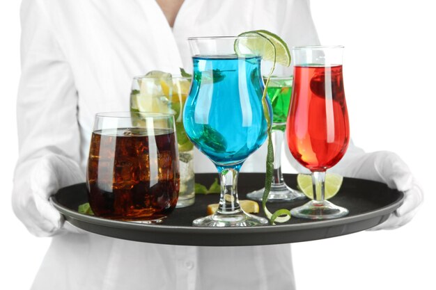 Waitresses holding tray with glasses of cocktails isolated on white